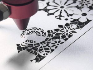 close up view of laser cutting paper sample - history of laser cutting