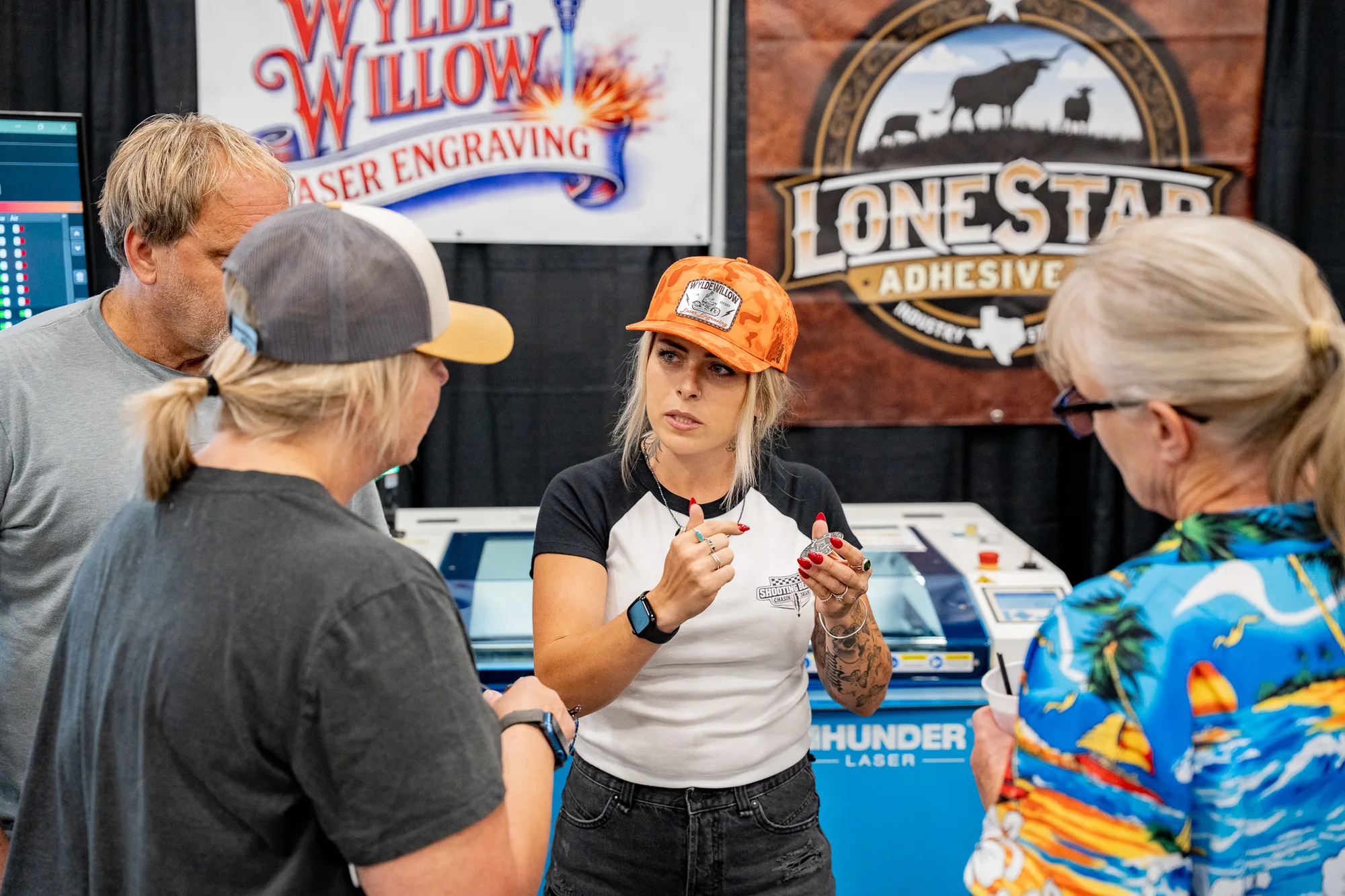 A Thunder Laser owner talking shop with visitors at Ignite